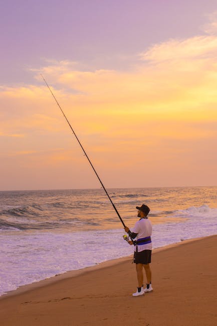 man fishing fro the beach