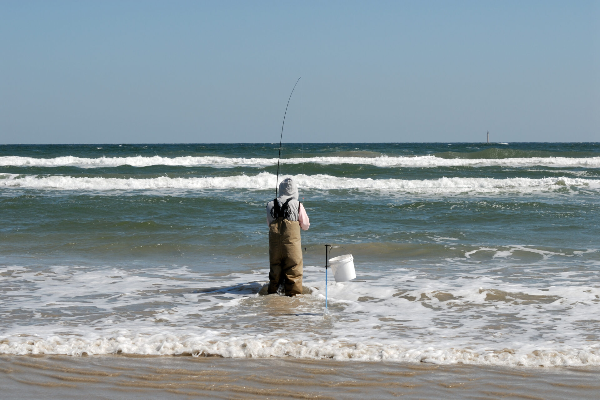 Fisherman on the beach, surf fishing, Padre Island, south Texas USA
